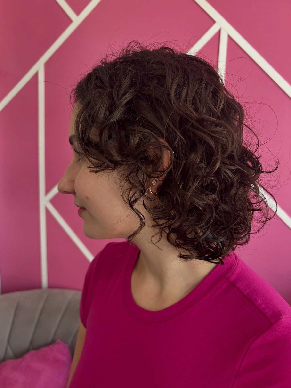 Defined shoulder-length curls after a curly cut